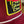 Patch on a maroon jacket with text and yellow border